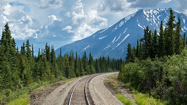 Railroad tracks leading into the Alaskan frontier