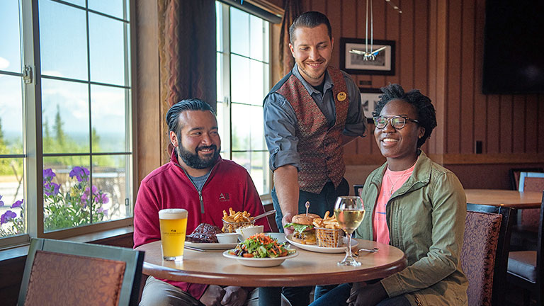 Guests in Whistle Stop Bar & Grill being served their meals