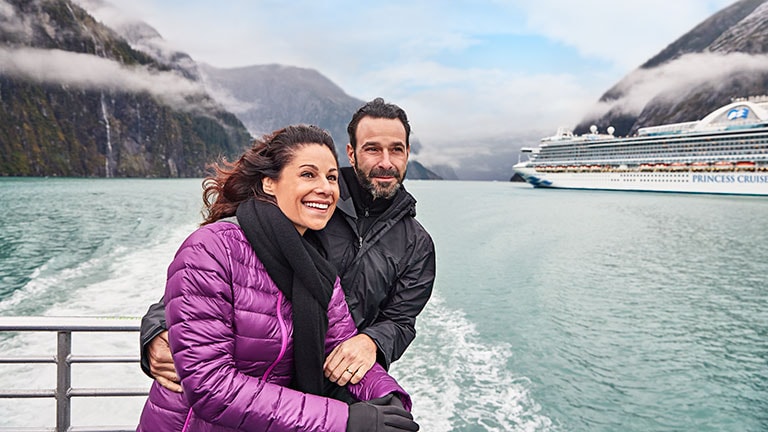 A couple enjoying scenic cruising in Tracy Arm Fjord on an Alaska cruise