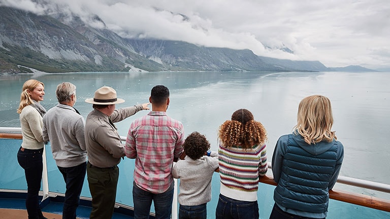 Passengers with a park ranger at glacier bay on board Alaska cruise