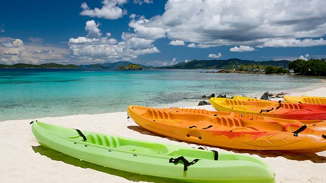 Kayaks on the beach duuring the summer on a Bahamas cruise 