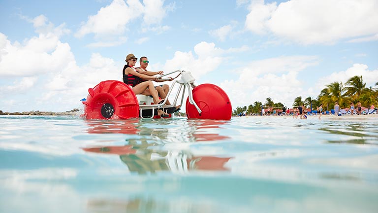 couple operating a water bike in the ocean