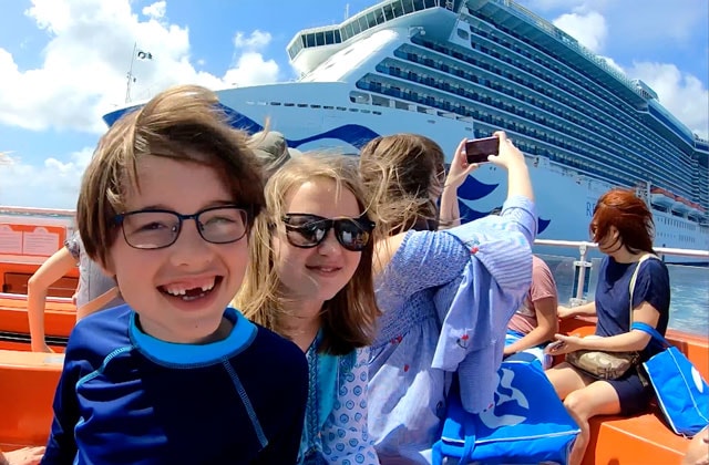 The holderness family standing in front of a princess ship