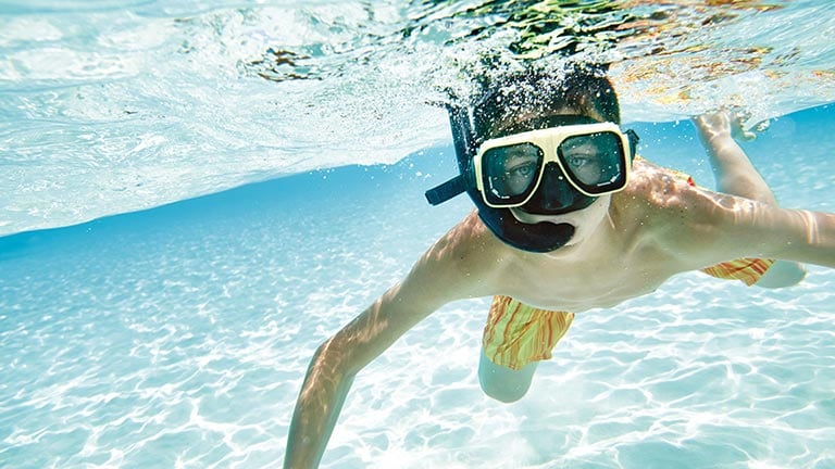 person swimming, snorkeling underwater