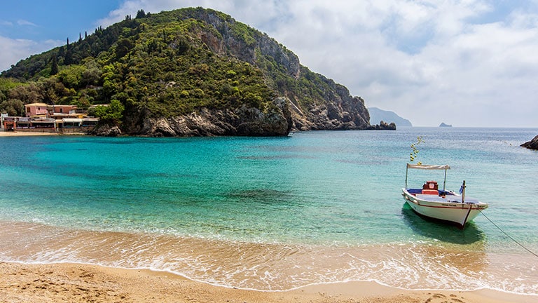 A small boat on the beach at Corfu, Greece