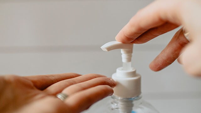 hand sanitizer being pumped into a hand